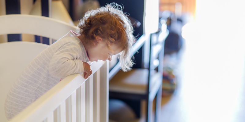 Toddler Climbing Out Of Cot