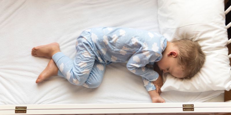 Toddler Climbing Out Of Cot